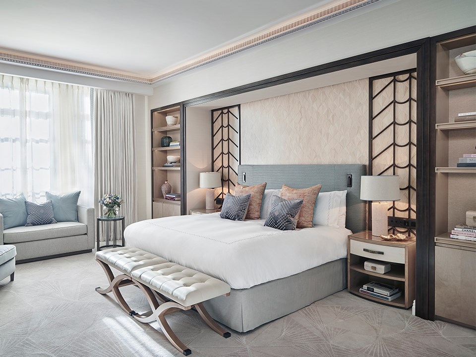 A view of a King Bed and a bedroom in a classic interior with Art Deco elements, in pastel colours of design.