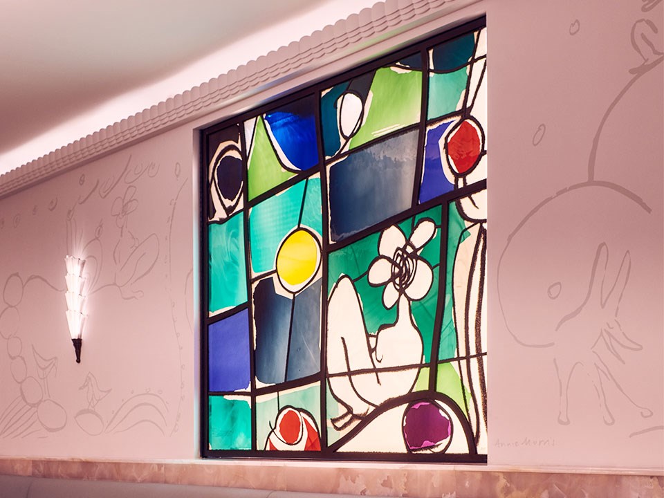 A stained glass window by Annie Morris inside the Painter's Room at Claridge's.