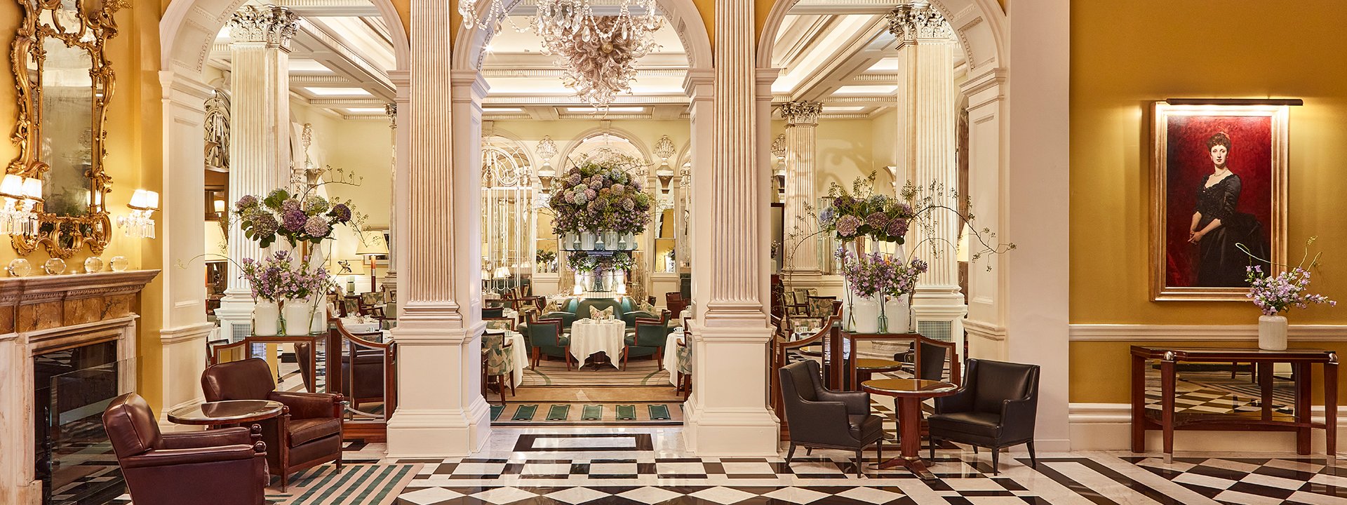 A view of the art deco lobby, and a blend of elegance in the interior of Claridge's with lavish flower arrangements.