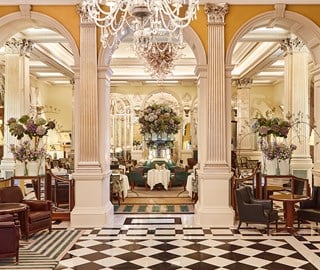 Art deco lobby, and the combination of elegance in the interior at Claridge's with magnificent flower arrangements.