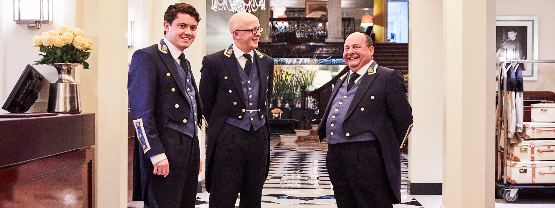 Photo of smiling concierge and The Hotel Ambassador, Martin Ballard, in the corridor of Claridge's Hotel.