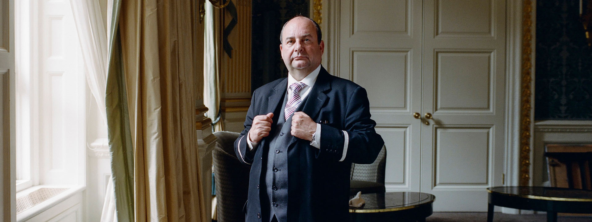 Portrait of The Hotel Ambassador, Martin Ballard, in the corridor of Claridge's Hotel.