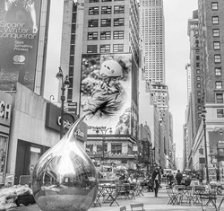 tea drop sculpture against the backdrop of tall buildings in New York