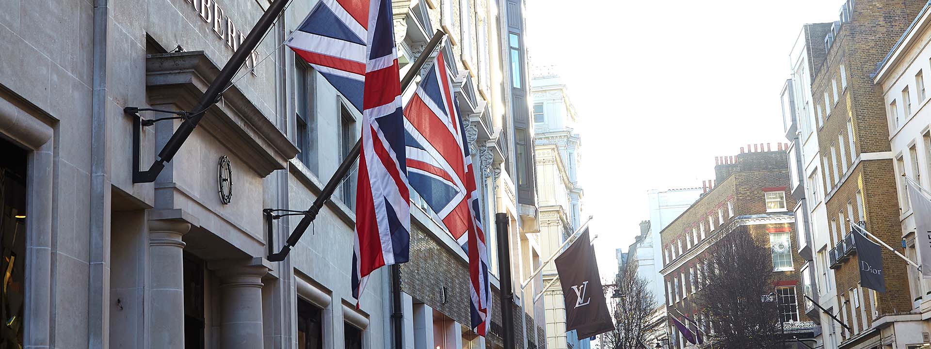A display of United Kingdom flags, while the rest of the street is in the background.