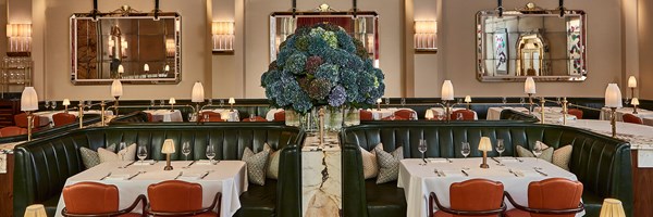 Claridge's restaurant, tables, chairs and a vase of blue hydrangeas