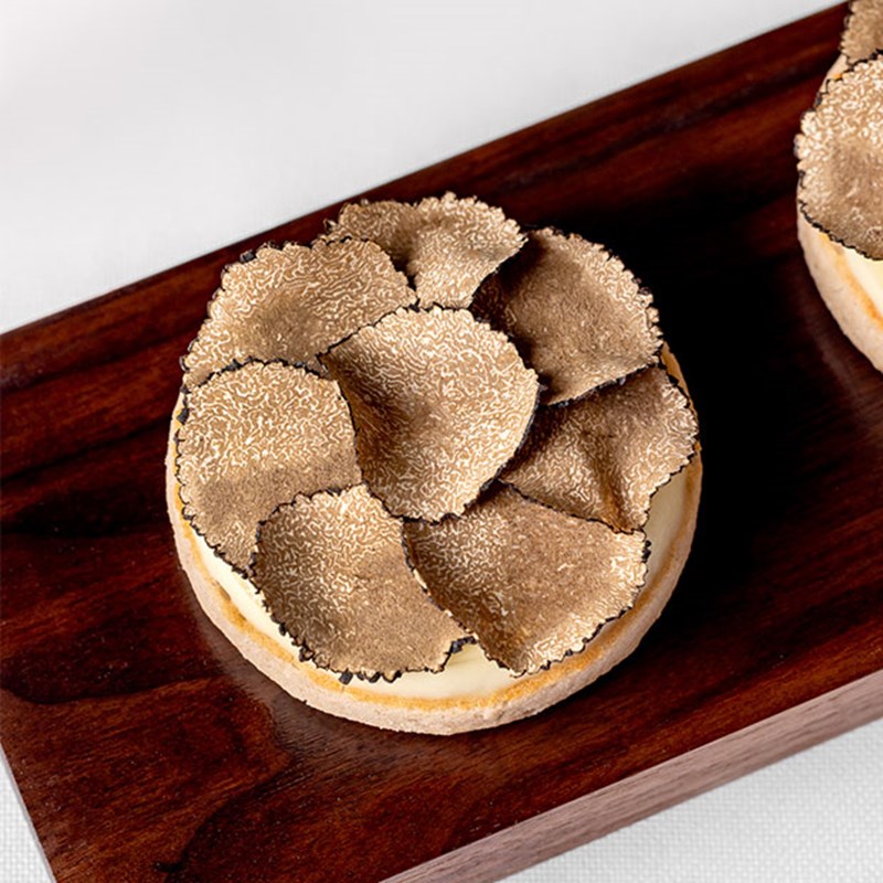 black truffles on a crumpet