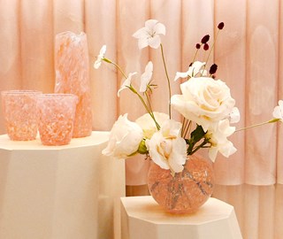 Presentation of vases, floral arrangements, and glass works as part of Claridge's collaboration with CURIO.