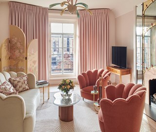 A divine interior in soft pink shades, with a sofa and armchairs in rich materials at Claridge's Hotel.