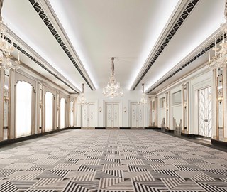 A view of the spacious room, designed in the art deco style, with elegant chandeliers at the Claridge's Hotel.