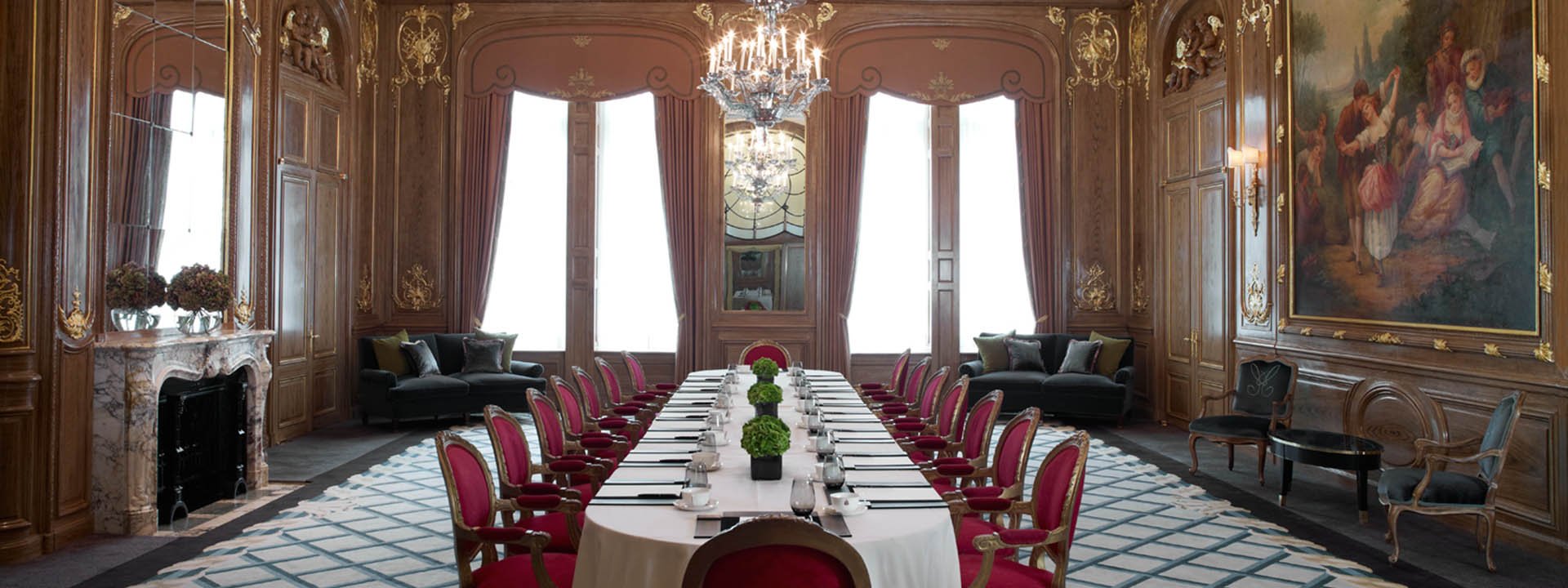 A view of the elegantly set the table for business meetings in the magnificent space of the French Salon.