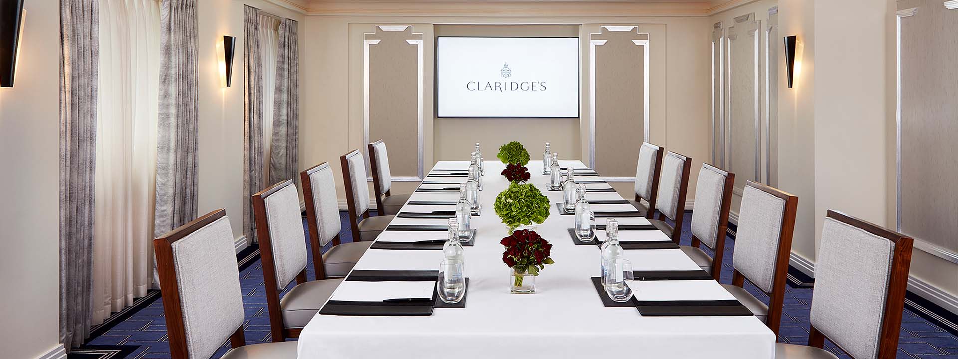 A view of the subtly decorated dining table for corporate needs in the elegant interior of the Highgrove Room.