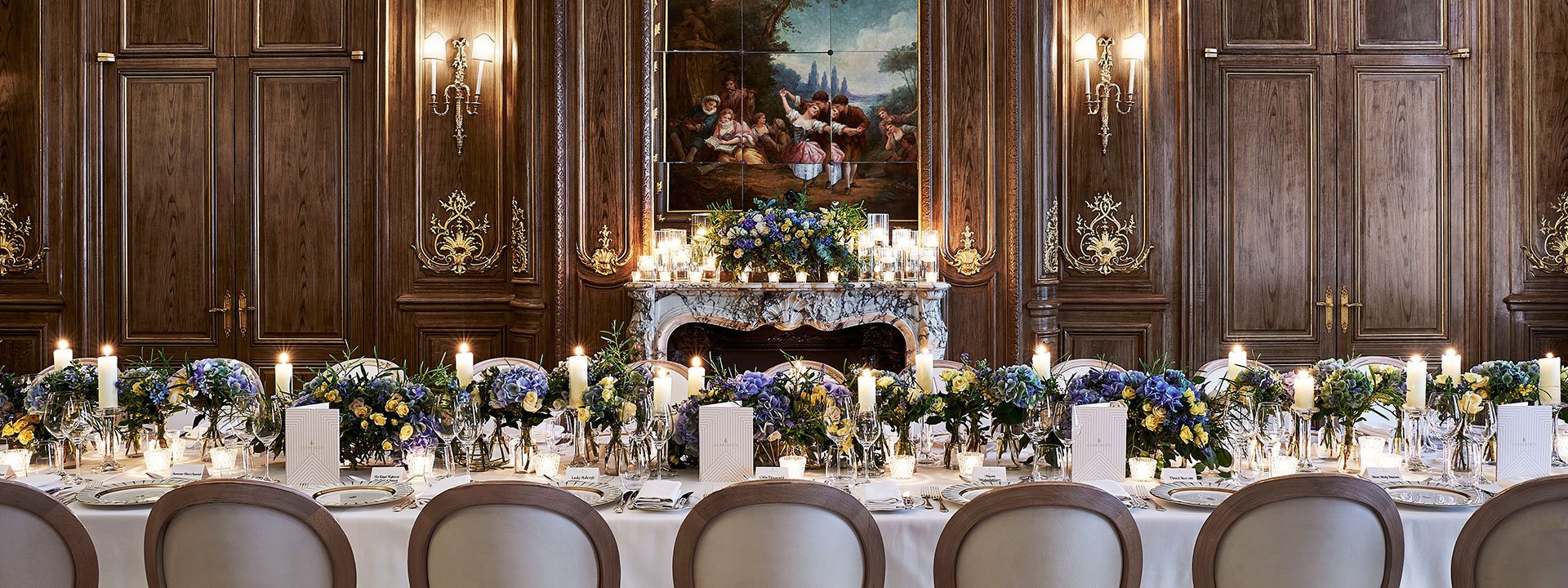 A view of the French Salon transformed for wedding purposes, romantically decorated with flowers and candles.