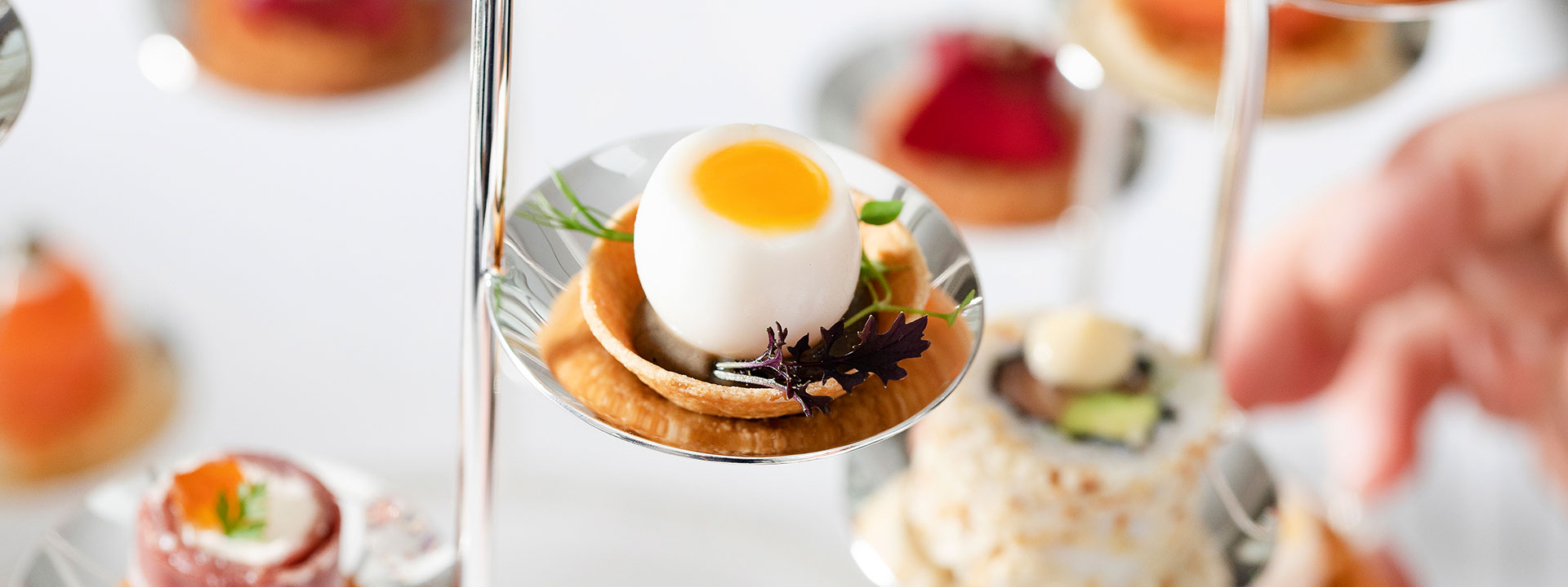 Boiled egg served on stainless steel holder at Claridge's Hotel, as a canap� or breakfast option.