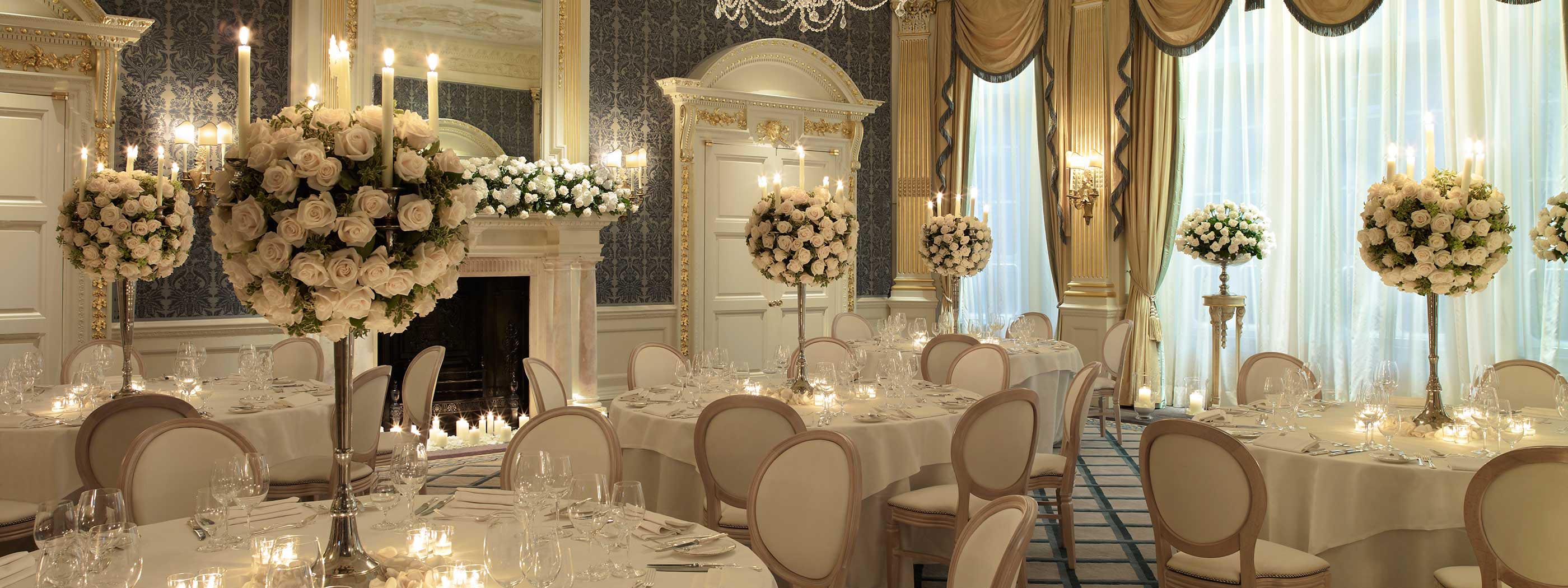 Beige and gold details in the Drawing Room, candles, and bouquet arrangements.