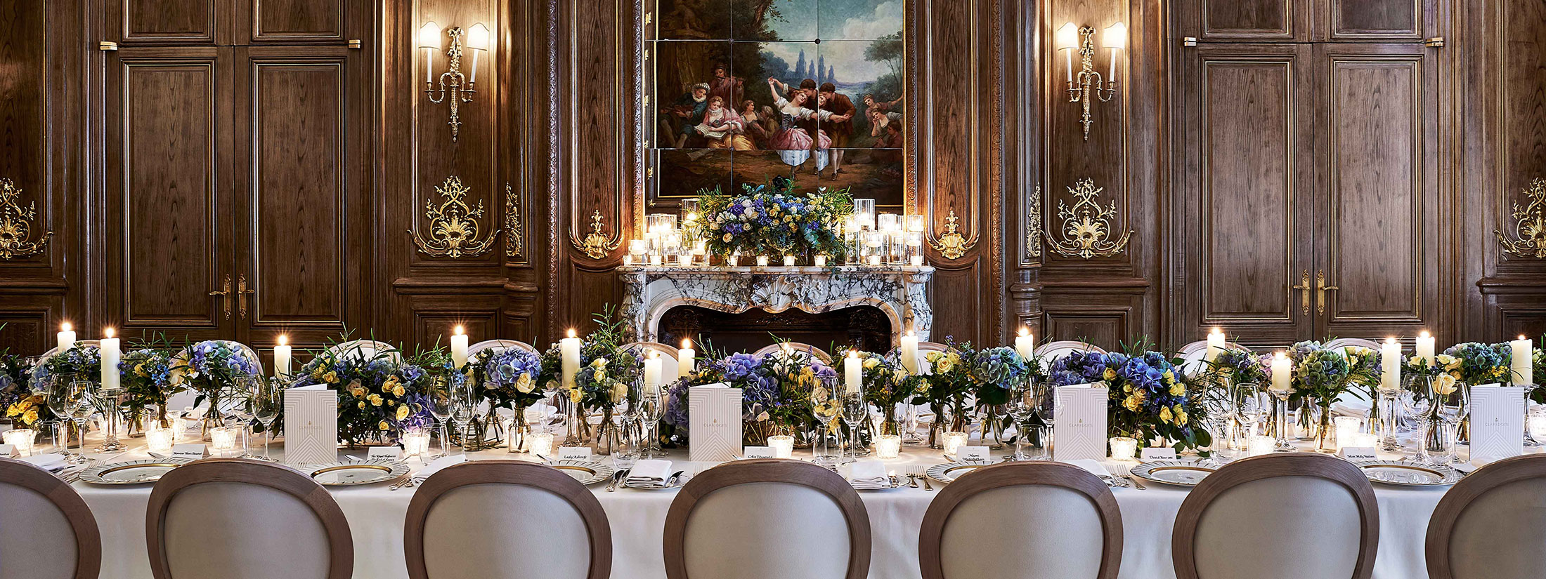 A view of the French Salon transformed for wedding purposes, romantically decorated with flowers and candles.
