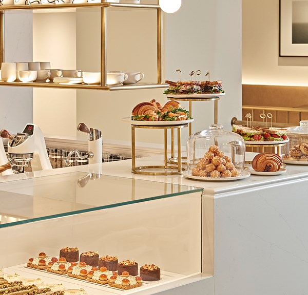 Claridge's Artspace Café counter with cakes and pastries on it.