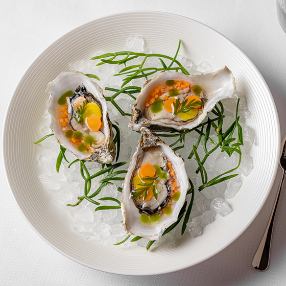 A trio of oysters served on ice at Claridge's Restaurant.