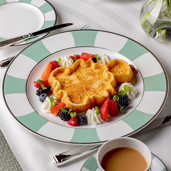 breakfast in foyer and reading room showing waffle dish in the form of the Claridge's crest decorated with a variety of berries