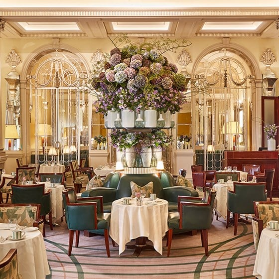 Luxurious floral centrepieces from The Foyer and Reading Room, with dining tables in the warm atmosphere of Claridge's.