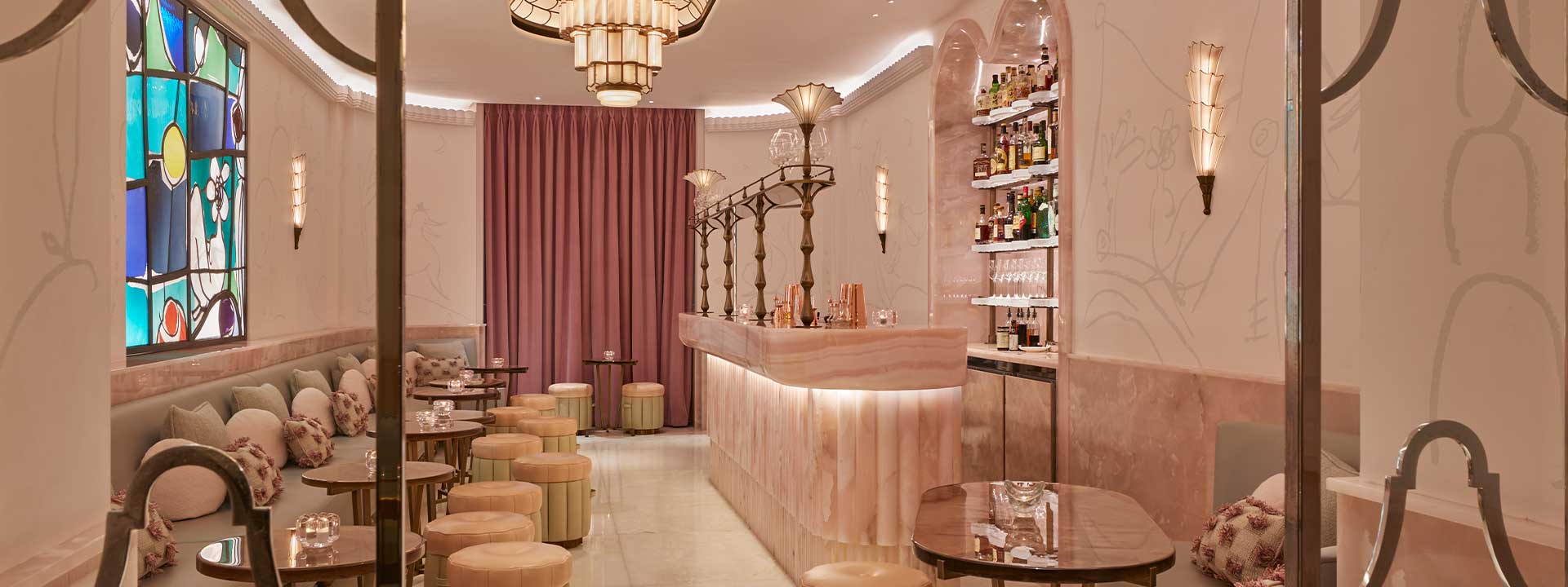 Pastel pink interior design of The Painter's Room cocktail bar at Claridge's Hotel, with lots of art deco elements.