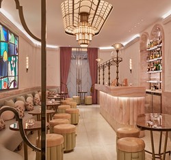 Pastel pink interior design of The Painter's Room cocktail bar at Claridge's Hotel.