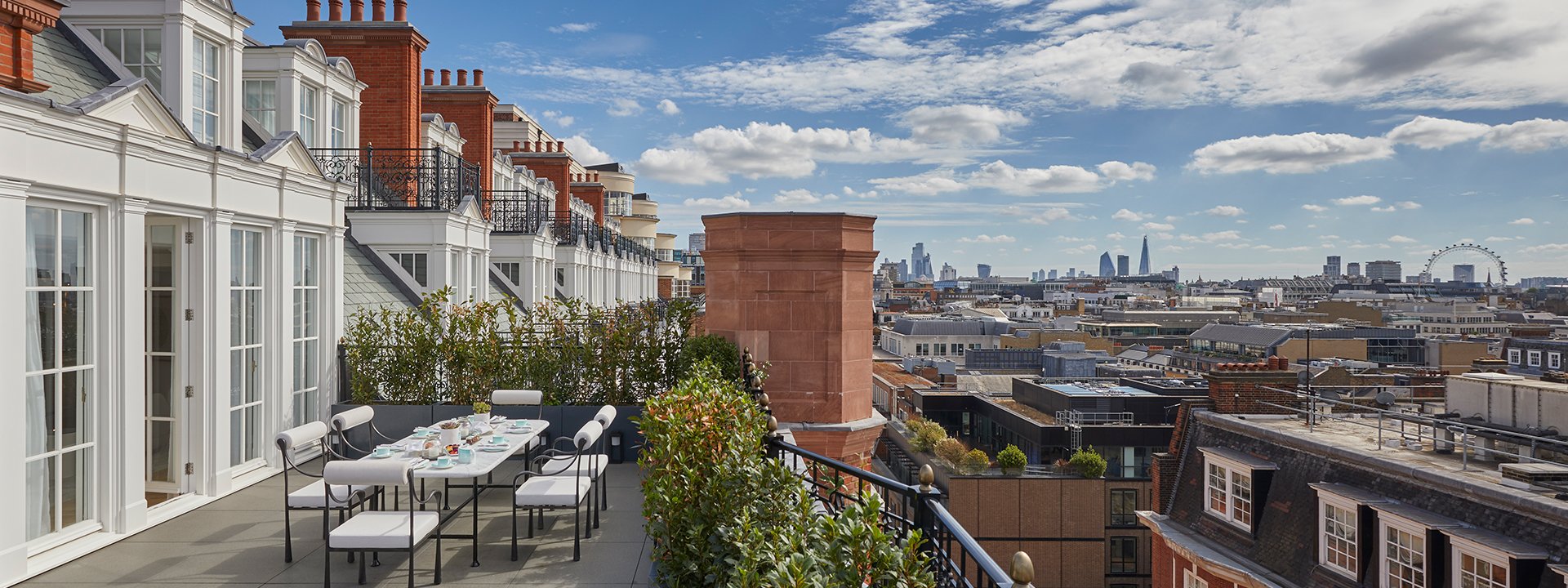 Claridge's Grand Terrace Suite - terrace with table and chairs and a view on the rooftops of London
