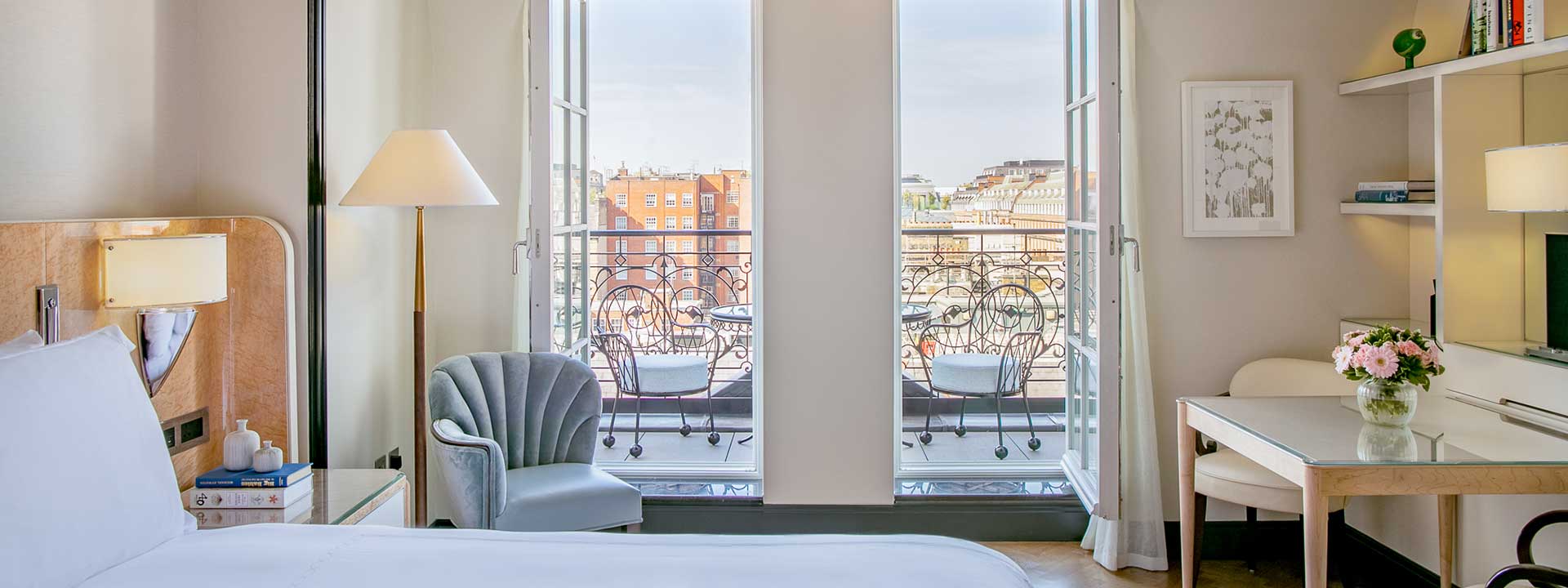 View of the open terrace from the bedroom in Claridge's Balcony Room, with rich details and features.