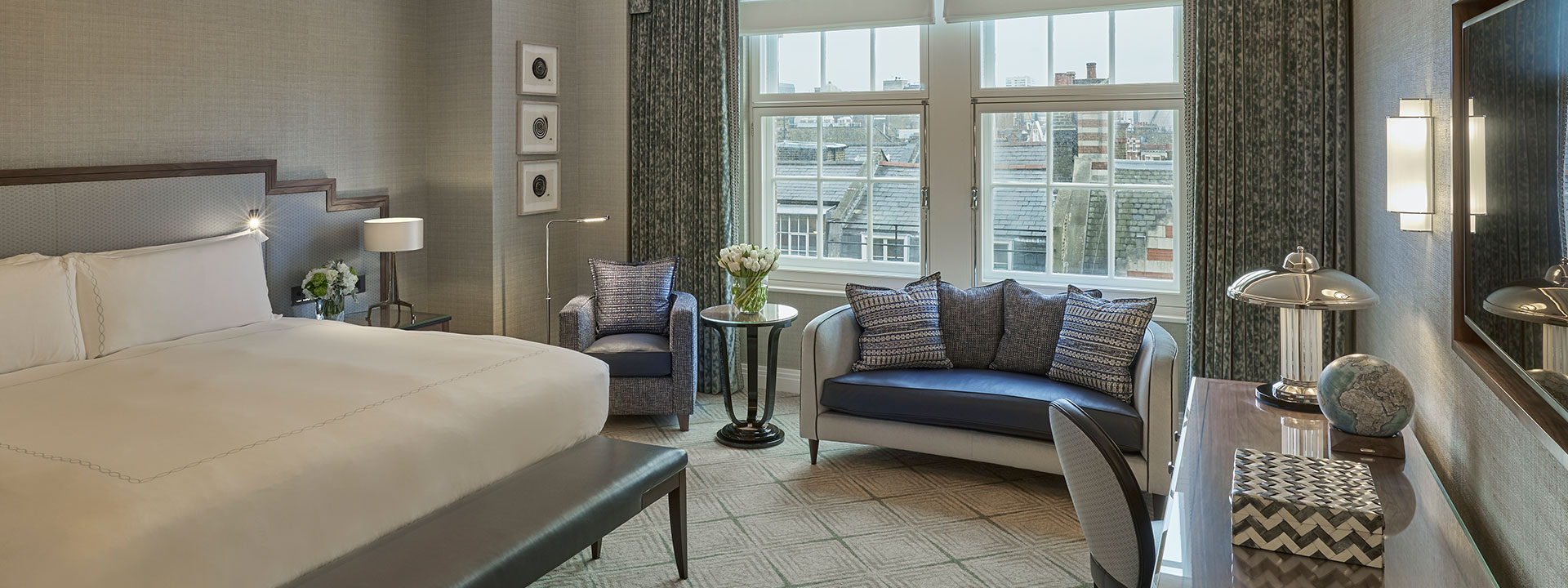 King Bed, sofa, armchair and business table in luxury interior design that can be found in Claridge's Studio.