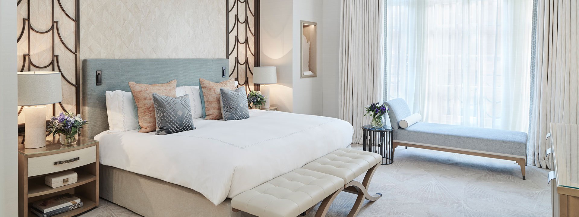 A view of a King Bed with pillows, in an elegant bedroom interior from Claridge's Suite.