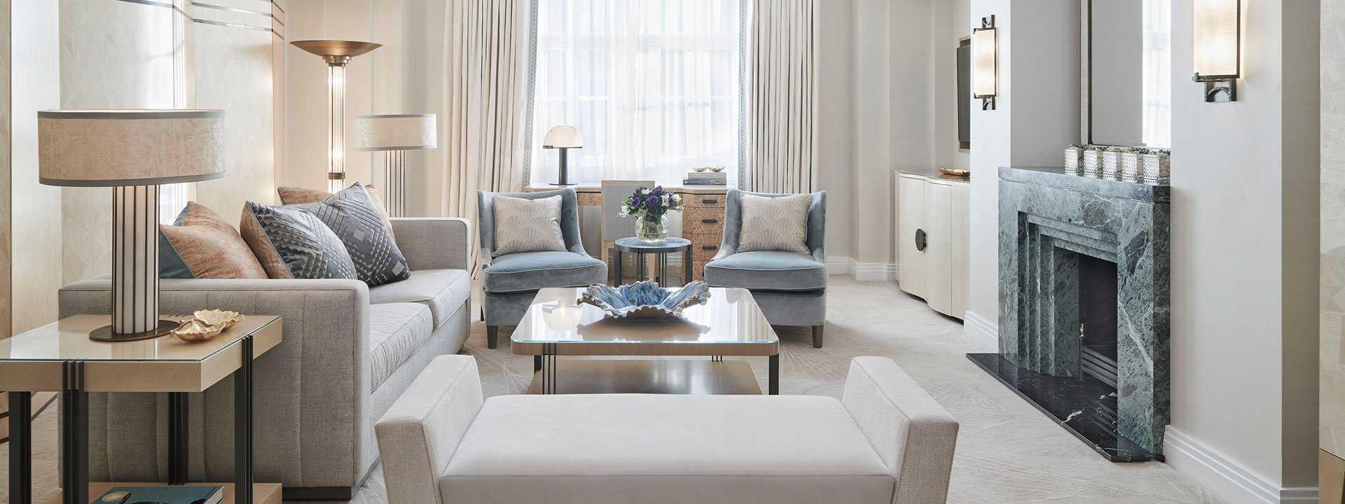 A fusion of elegant design with art deco elements in the interior of the living room in Claridge's Suite.