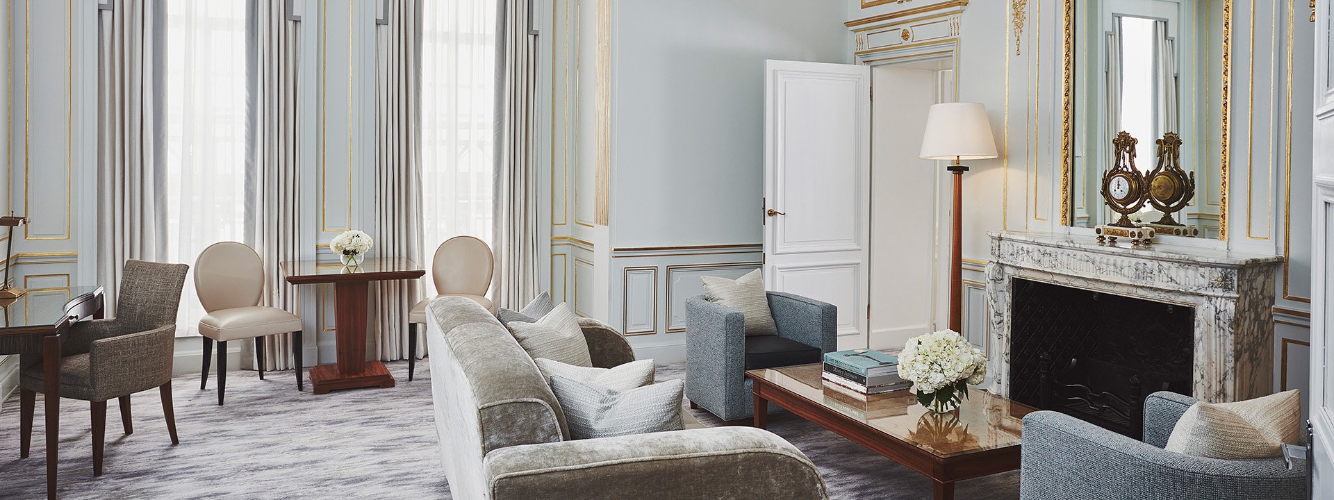 A fusion of traditional and Art Deco design in the sitting room from Claridge's Suite, with comfortable sofas and armchairs.