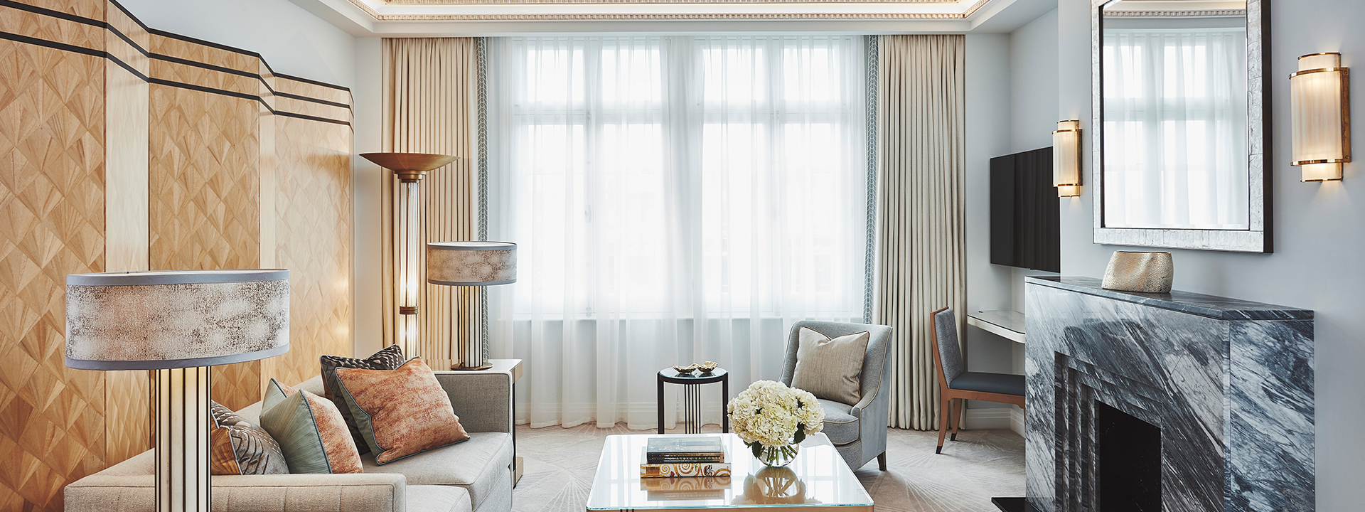 Magnificent sitting room in Claridge's Suite, with luxurious details in the interior with lots of natural daylight.