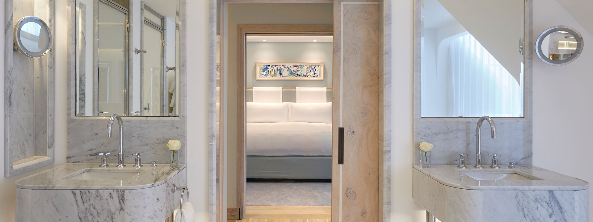 View of the bedroom from the marble-designed bathroom of the Corner Terrace Suite.