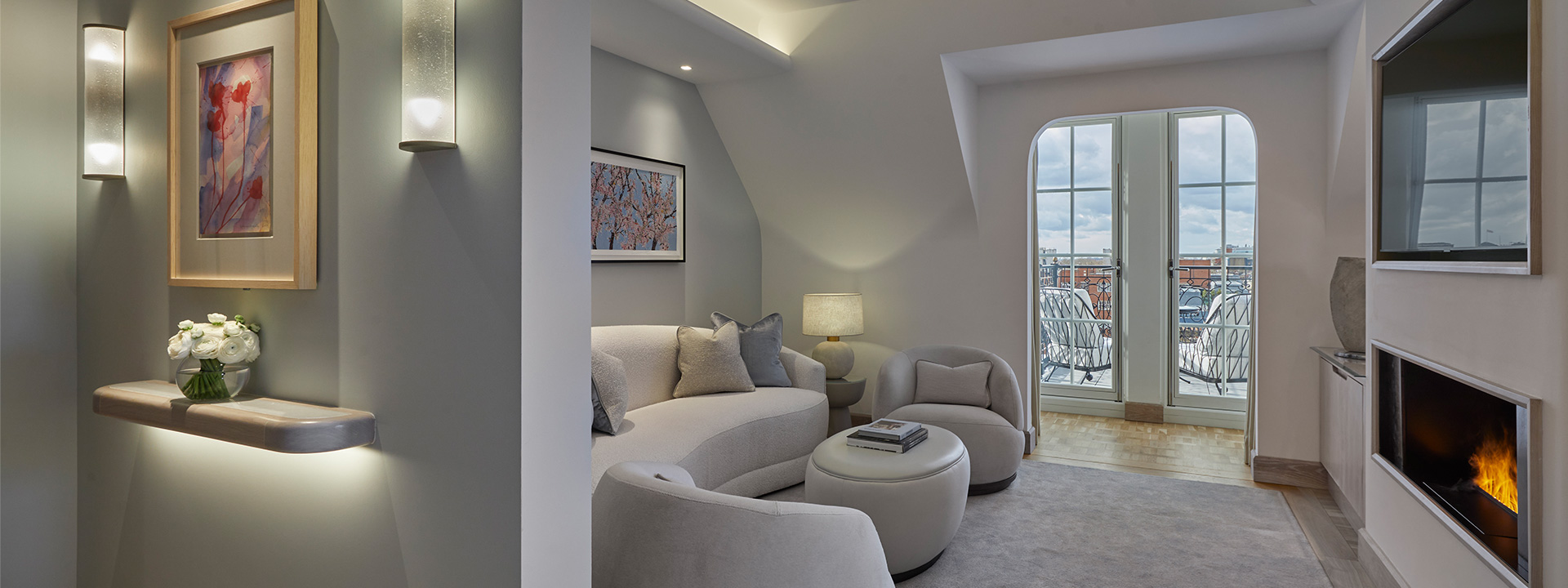 The sitting room in the Corner Terrace Suite is enriched with natural daylight with its neutral interior tones.