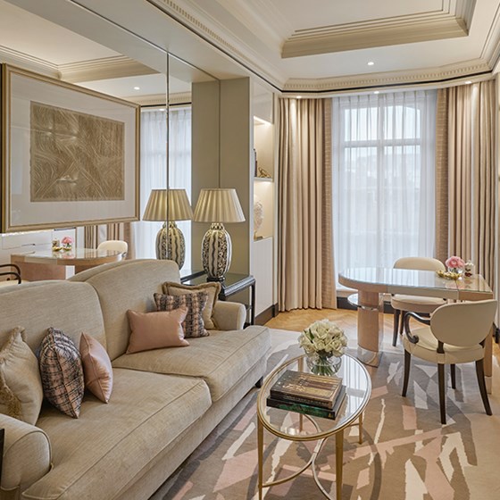 A rich, bright space with lots of art deco elements and furniture in a champagne-coloured interior at Claridge's Hotel.