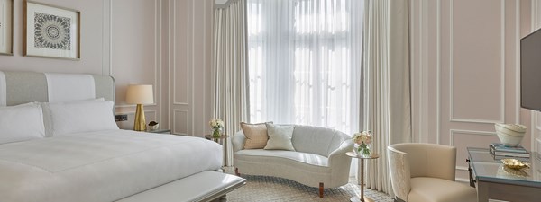 Grand Piano Suite at Claridge's - bedroom with bed, sofa next to the window and desk next to the wall.