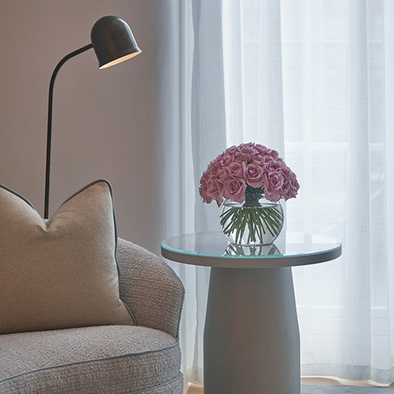 Grand Terrace Suite at Claridge's - flowers on a table stand next to a sofa.