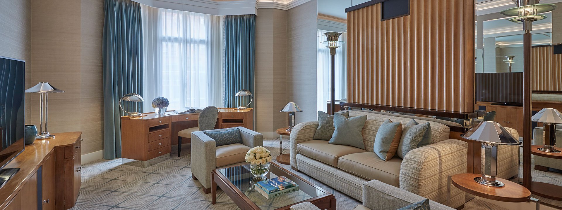 A view of the contemporary living room interior of the Mayfair Suite, and comfortable furniture with a soothing palette.