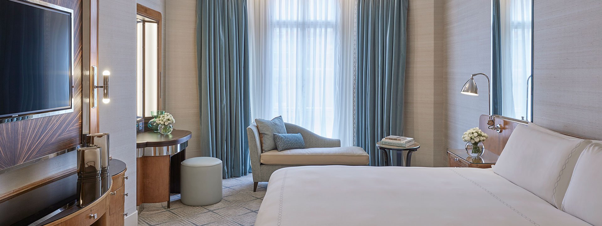 A view of the elegant bedroom of the Mayfair Suite, and one King Bed with luxurious features.