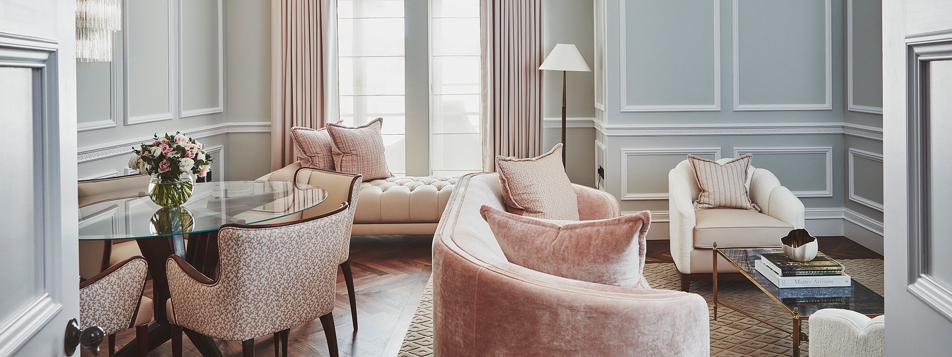 Comfortable sofas and armchairs in the luxurious interior of the sitting room in the Mayfair Terrace Suite.