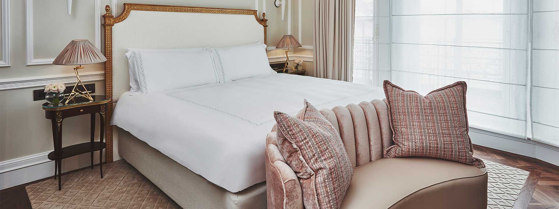 A view of the King Bed in the Mayfair Terrace Suite, surrounded by lavish details in the bedroom interior.