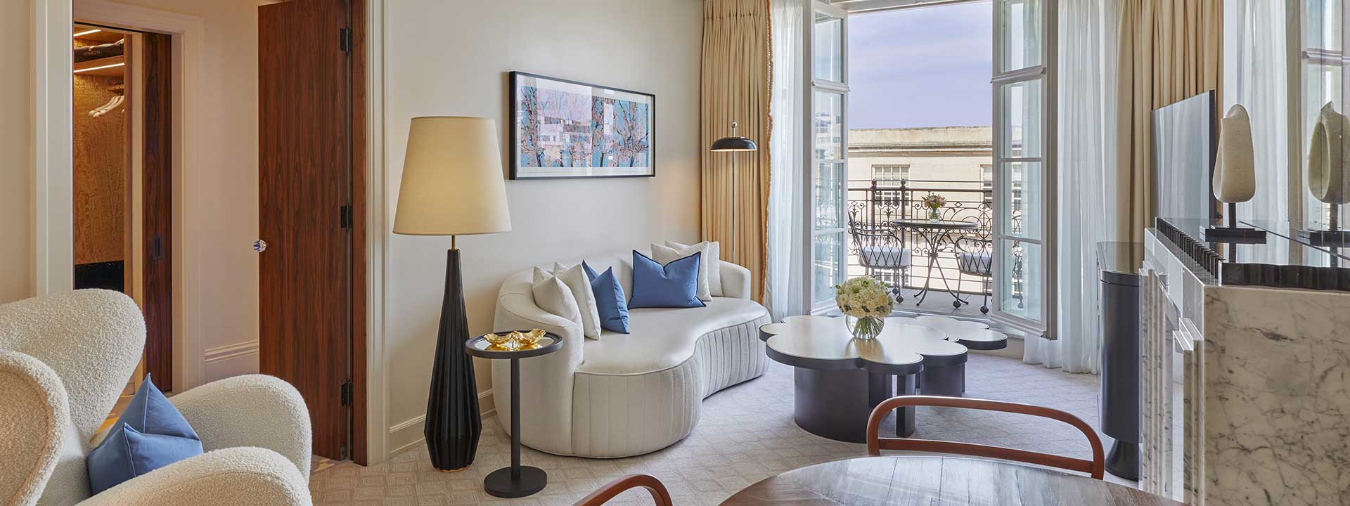 A view of golden age deco interior design in the Mayfair Terrace Suite sitting room.