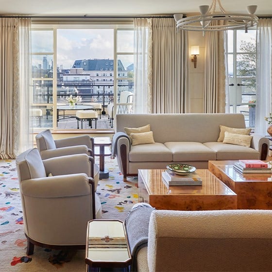 A view of the living room, elegant armchairs and sofas in an art deco interior from The Mews Terrace.