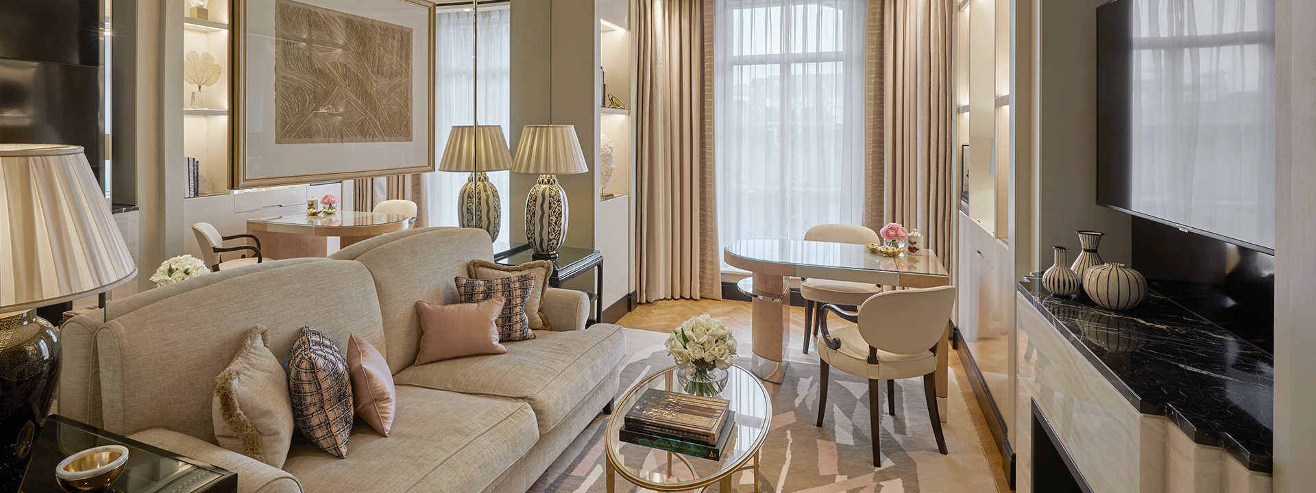 A view of the Deluxe Junior Suite, which exudes comfort in the gold, beige and champagne colours of its sofas.
