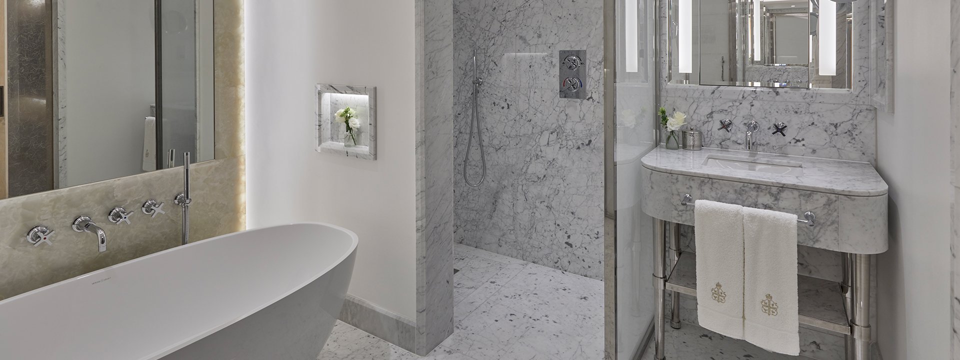 Spacious marble bathroom in neutral and contemporary colours in the Terrace Junior Suite.