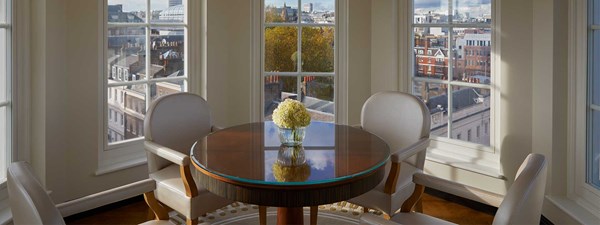A view of the table and chairs from The Mayfair Pavilion, at Claridge's, in an elegant design with beautiful views outside.