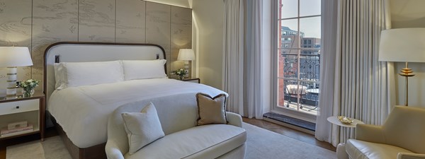 Bedroom in art deco interior from The Octagon suite, with one emperor bed and elegant design.