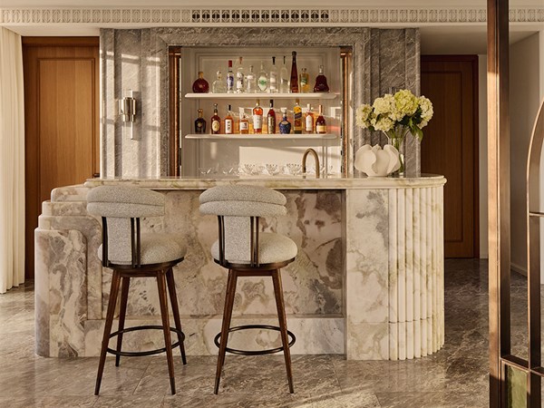 Luxurious marble area with two barstools