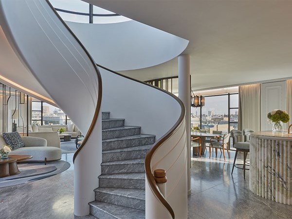 Spiral shaped staircase in the middle of a large suite