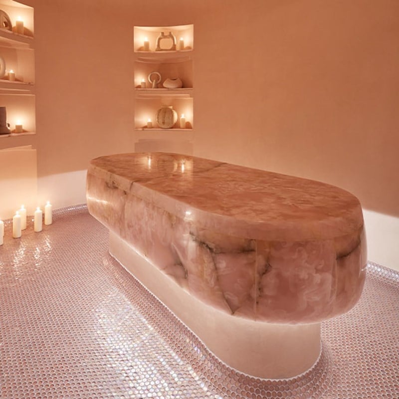 h aesthetic featruring pink onyx bed, candles, shelves and ornaments